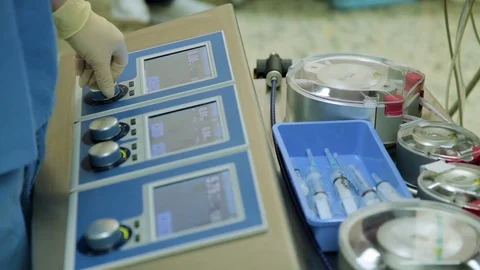 Perfusionist control heart lung machine in operating room. Close-up Stock Footage 74214484