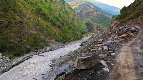 A perilous, rugged mountain trail along the Kali River on the Adi Kailash route Stock Footage 342394651