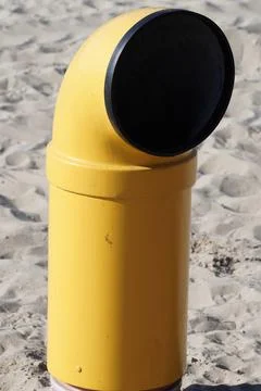 Periscope-shaped garbage can on the beach Stock Photos