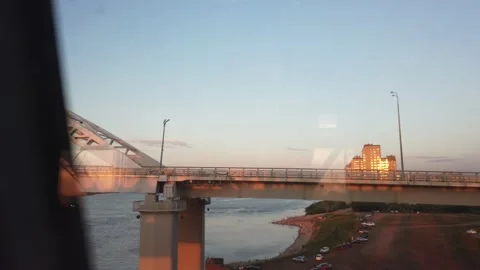Perm rail bridge at sunset. View of the Kama River from the train car Stock-Footage 136048666