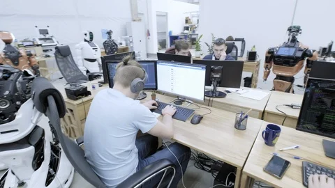 PERM RUSSIA - 13.12.2018: A group of software engineers create software code for Stock Footage 101558644