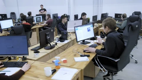 PERM RUSSIA - 13.12.2018: A group of software engineers create software code for Stock Footage 101560699