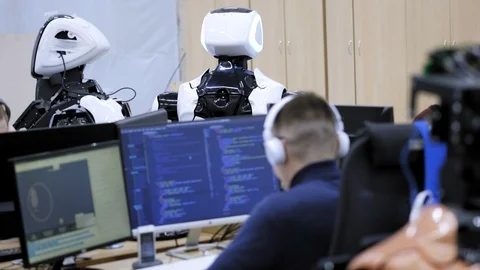 PERM RUSSIA - 13.12.2018: A group of software engineers create software code for Stock Footage 101564232