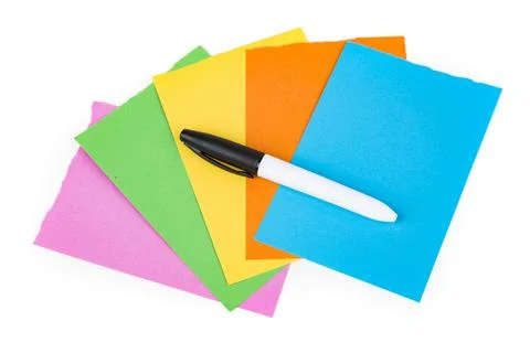 Permanent black marker on multicolored note pad papers isolated over white. T Stock Photos