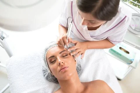 Permanent cosmetics making brows look denser and fuller Stock Photos