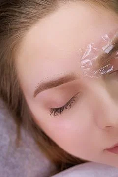 Permanent eyebrow makeup PMU procedure Stock Photos