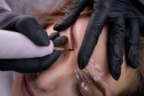 Permanent eyebrow makeup PMU procedure Stock Photos