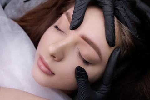 Permanent eyebrow makeup PMU procedure Stock Photos