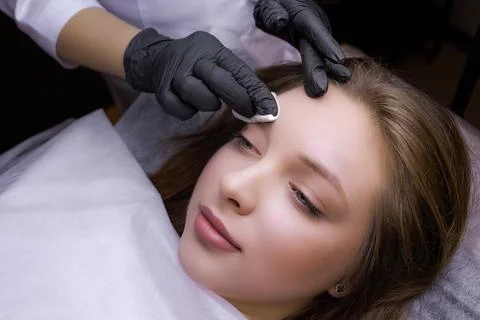 Permanent eyebrow makeup PMU procedure Stock Photos