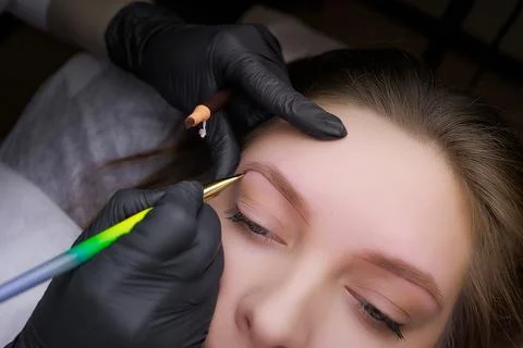 Permanent eyebrow makeup PMU procedure Stock Photos
