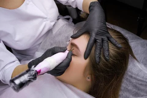 Permanent eyebrow makeup PMU procedure Stock Photos