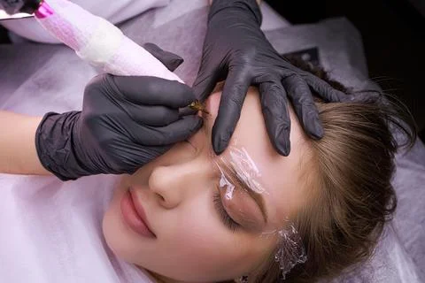 Permanent eyebrow makeup PMU procedure Stock Photos