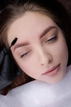 Permanent eyebrow makeup PMU procedure Stock Photos
