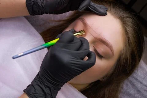 Permanent eyebrow makeup PMU procedure Foto stock