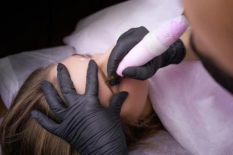 Permanent eyebrow makeup PMU procedure Stock Photos