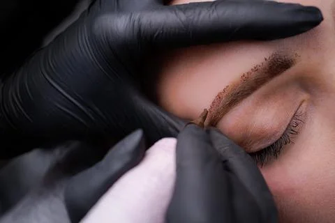 Permanent eyebrow makeup PMU procedure Stock Photos