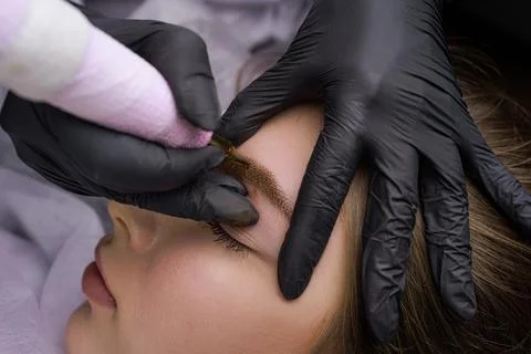 Permanent eyebrow makeup PMU procedure Stock Photos