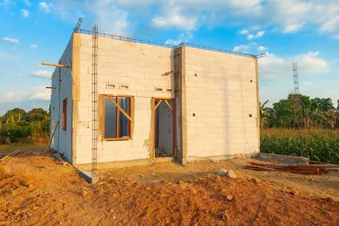 A permanent house made of lightweight brick is currently under construction. Stock Photos