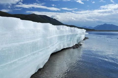 The permanent ice fields in the tideway of the Yakut river. Stock Photos