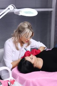 Permanent Make-up on her Lips. Stock Photos