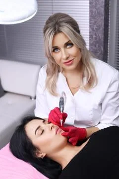 Permanent Make-up on her Lips. Stock Photos