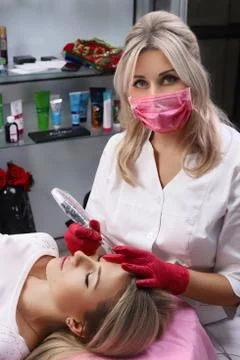 Permanent Make-up on her Lips. Stock Photos