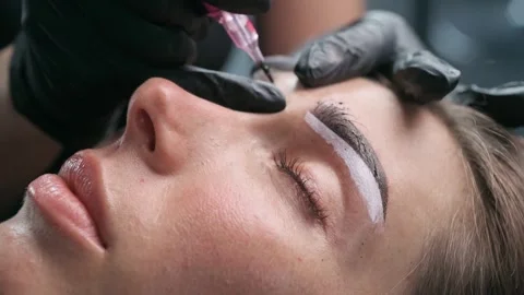 Permanent Makeup Artist Performing Eyebrow Tattoo Stock-Footage 342833590
