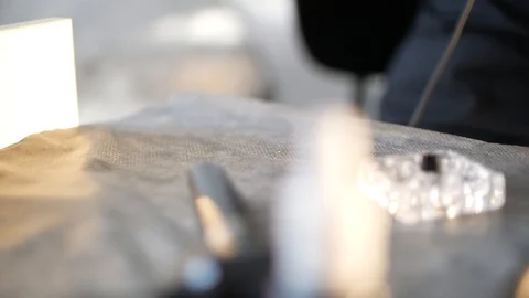 A permanent makeup artist put permanent makeup tattoo machine on the table. Stock Footage 126952928