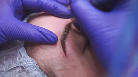 Permanent makeup. Eyebrow tattoos, close up Stock Footage 164281366