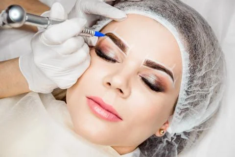 Permanent Makeup For Eyebrows. Closeup Of Beautiful Woman With Thick Brows In Stock Photos