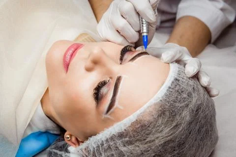 Permanent Makeup For Eyebrows. Closeup Of Beautiful Woman With Thick Brows In Stock Photos