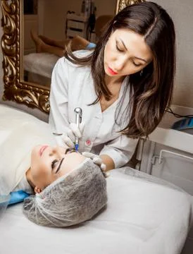 Permanent Makeup For Eyebrows. Closeup Of Beautiful Woman With Thick Brows In Stock Photos