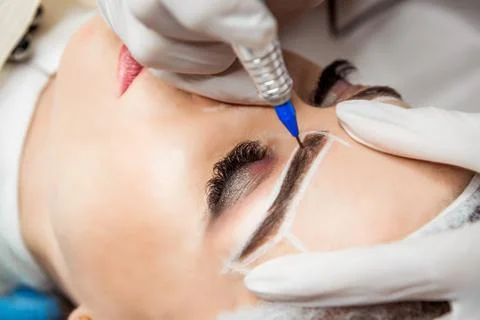 Permanent Makeup For Eyebrows. Closeup Of Beautiful Woman With Thick Brows In Stock Photos