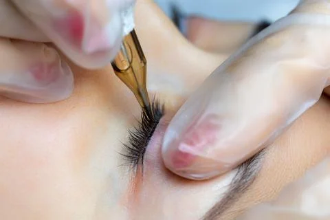 Permanent makeup of eyelashes tattooing Stock Photos