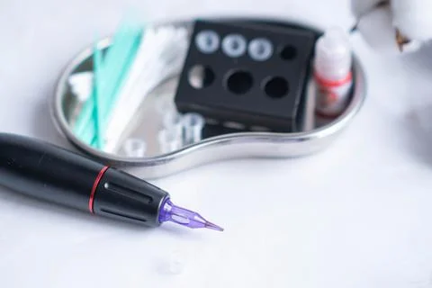 Permanent makeup machine for eyebrows and lips Stock Photos