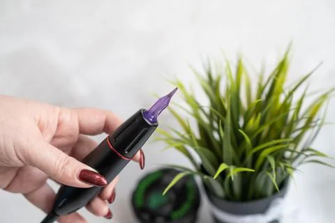 Permanent makeup machine for eyebrows and lips Stock Photos