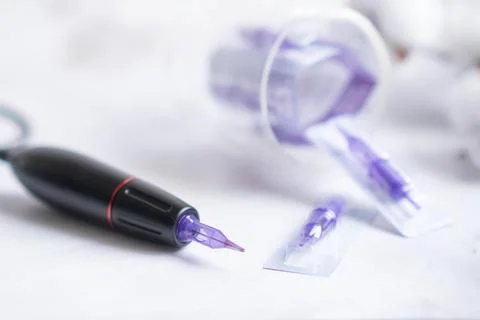 Permanent makeup machine for eyebrows and lips Stock Photos