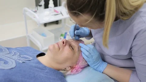Permanent makeup. Permanent tattooing of eyebrows. Stock Footage 80029975