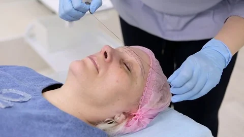 Permanent makeup. Permanent tattooing of eyebrows. Stock Footage 80031675
