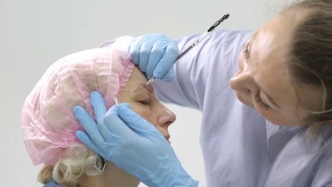 Permanent makeup. Permanent tattooing of eyebrows. Stock Footage 80032661