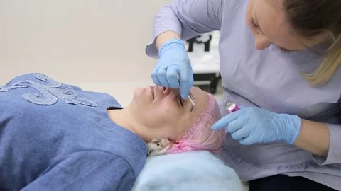 Permanent makeup. Permanent tattooing of eyebrows. Stock Footage 80034204