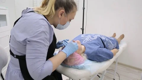 Permanent makeup. Permanent tattooing of eyebrows. Stock-Footage 80136985