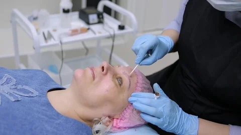 Permanent makeup. Permanent tattooing of eyebrows. Stock-Footage 80137293