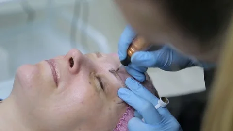 Permanent makeup. Permanent tattooing of eyebrows. Stock Footage 80137354