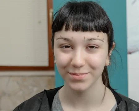 Permanent makeup. Permanent tattooing of eyebrows Stock Photos