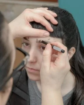 Permanent makeup. Permanent tattooing of eyebrows Stock Photos