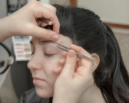 Permanent makeup. Permanent tattooing of eyebrows Stock Photos