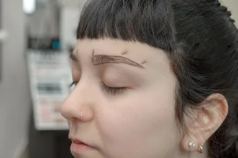 Permanent makeup. Permanent tattooing of eyebrows Stock Photos