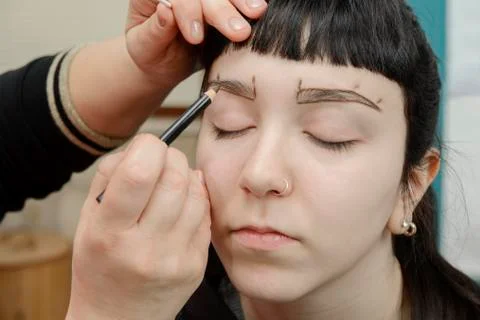 Permanent makeup. Permanent tattooing of eyebrows Stock Photos