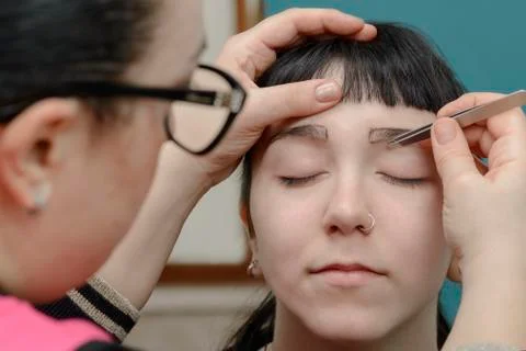 Permanent makeup. Permanent tattooing of eyebrows Stock Photos
